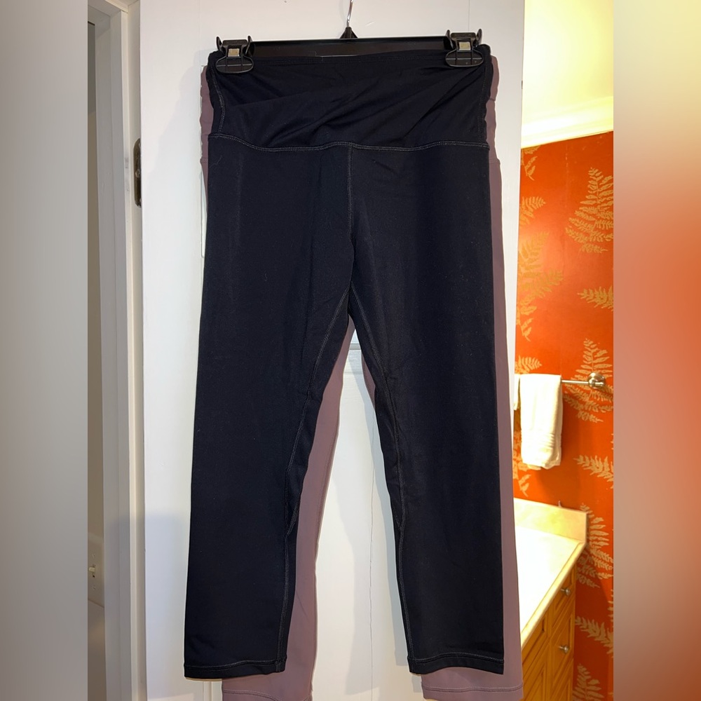 Two pairs of crossover high-waisted leggings. Both size M, never worn.